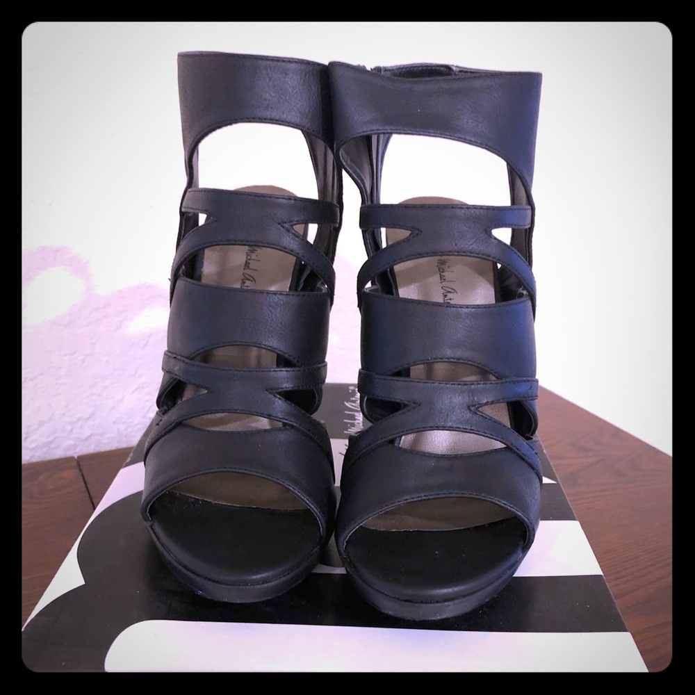 Black, ankle high, strappy  heel with zipper close